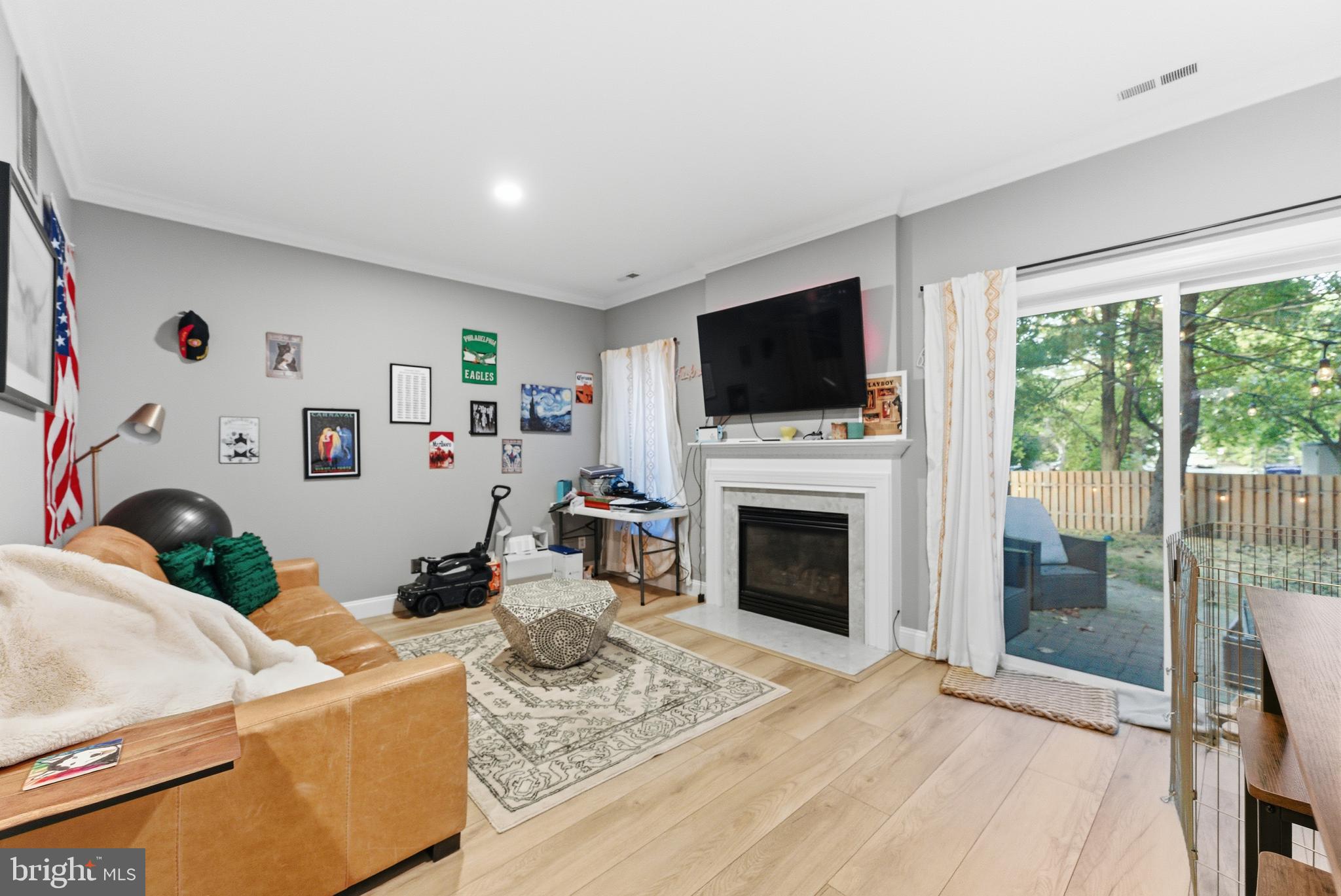 1 Weatherly Road Delran, NJ 08075 - Photo 17 of 32 a living room with furniture a flat screen tv and a fireplace