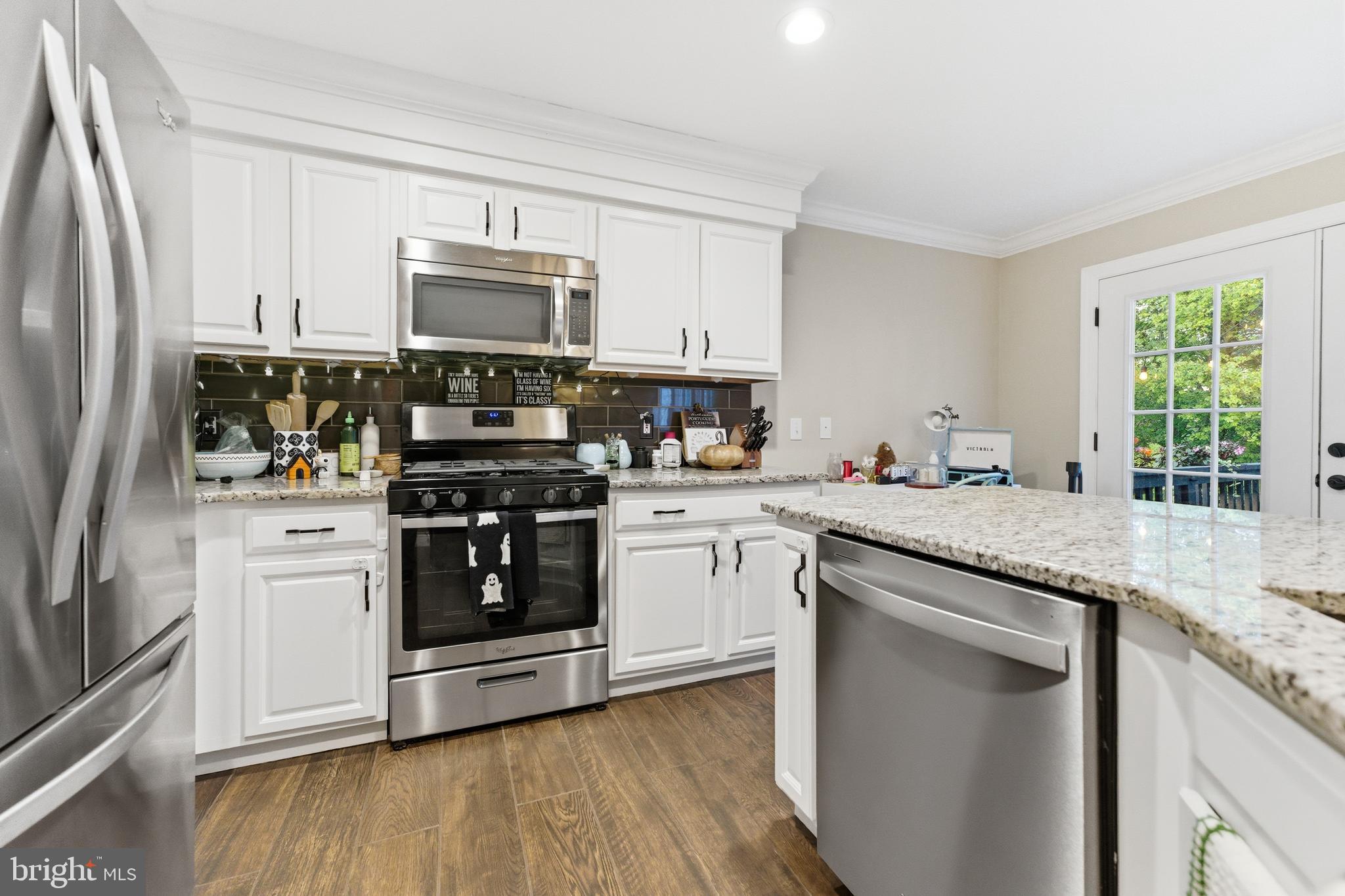 1 Weatherly Road Delran, NJ 08075 - Photo 4 of 32 a kitchen with stainless steel appliances granite countertop a stove a sink and a refrigerator