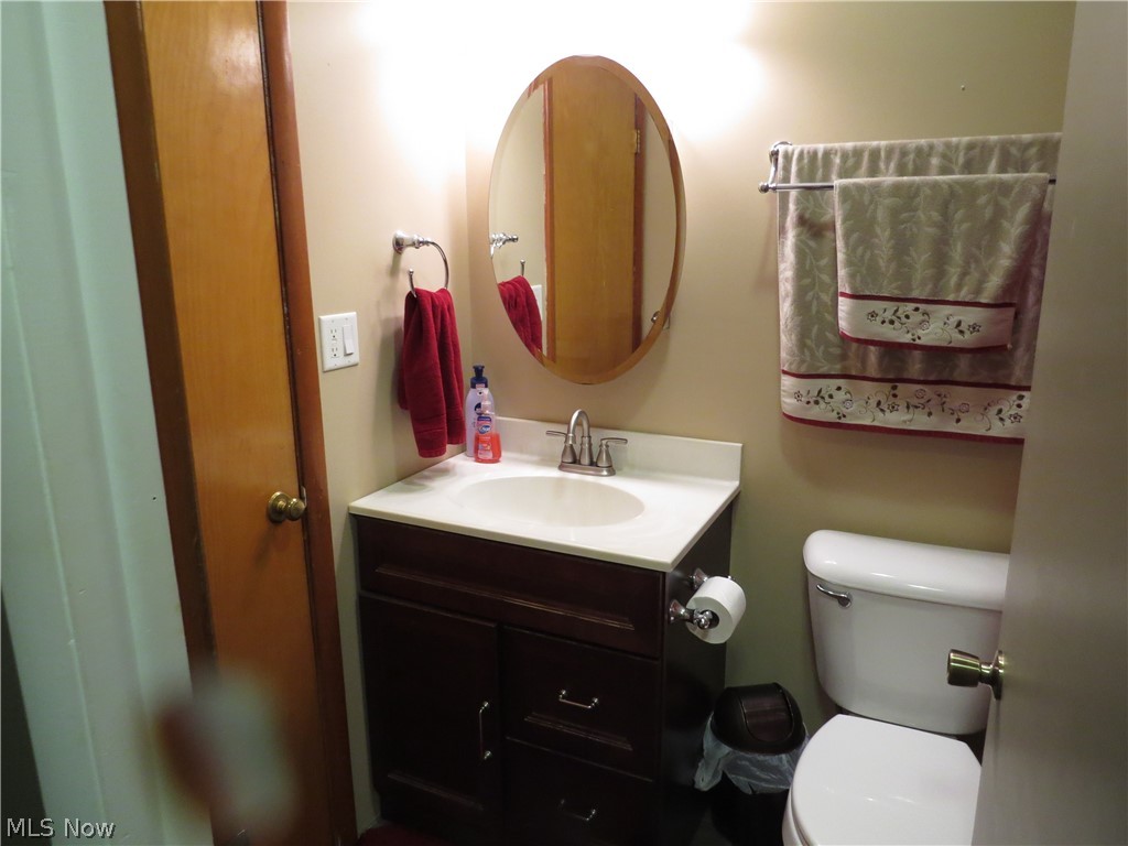 9811 Church Road Huron, OH 44839 - Photo 18 of 28 Bathroom featuring vanity and toilet