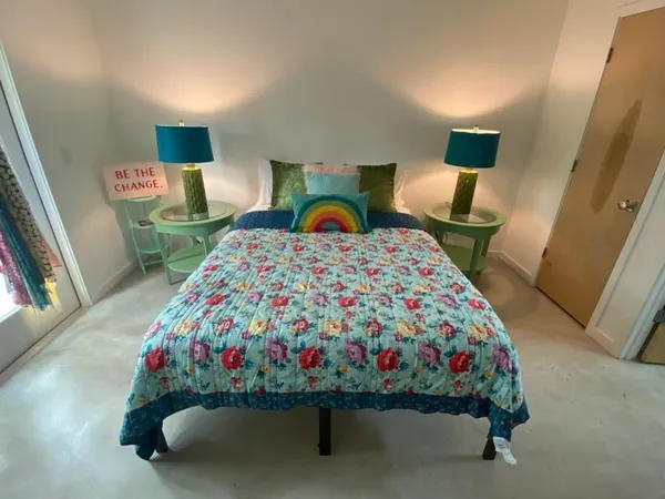 a bedroom with a bed and dresser