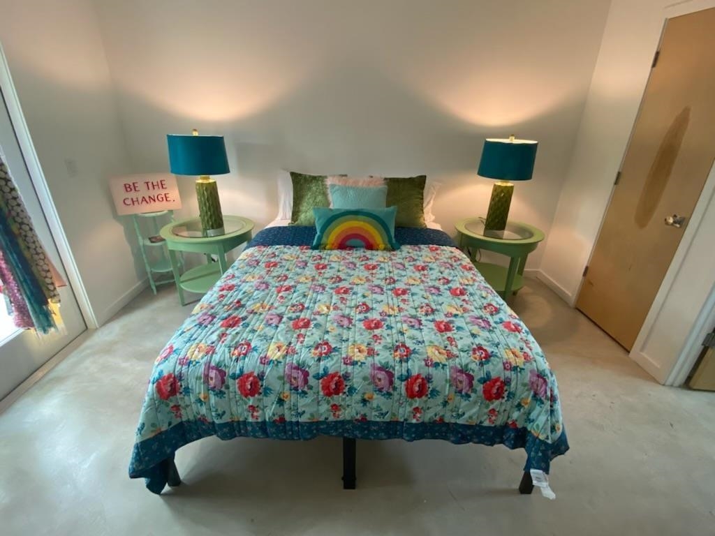 1417 Highland Boulevard St. Augustine, FL 32084 - Photo 6 of 8 a bedroom with a bed and dresser