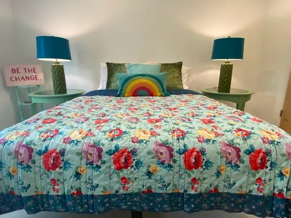 a bedroom with a bed and a dresser