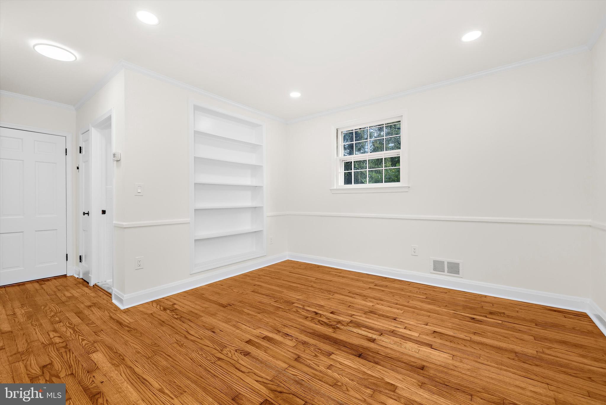 2301 Pickwick Road Baltimore, MD 21207 - Photo 21 of 50 a view of empty room with wooden floor