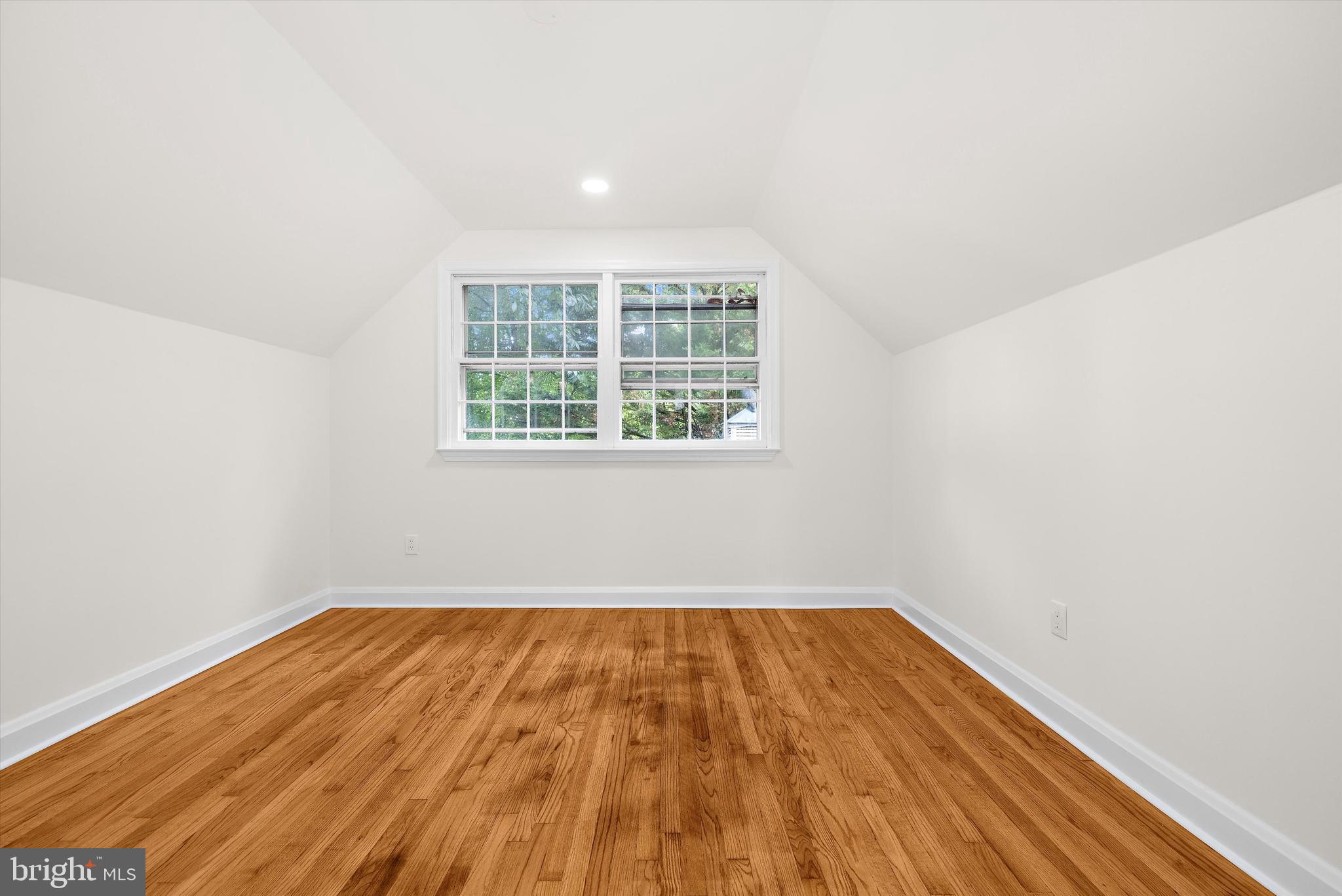 2301 Pickwick Road Baltimore, MD 21207 - Photo 28 of 50 an empty room with wooden floor and windows