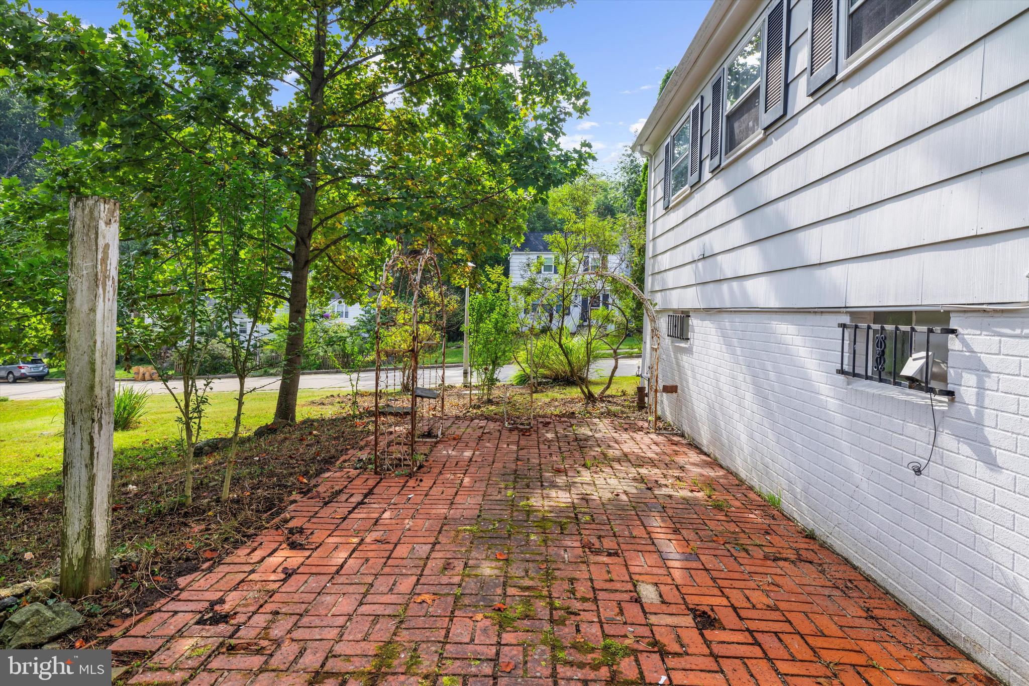 2301 Pickwick Road Baltimore, MD 21207 - Photo 35 of 50 a view of a pathway with a yard