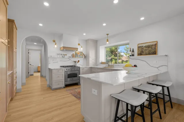 a kitchen with a stove and a sink