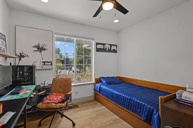 a view of a city with a tree in the background