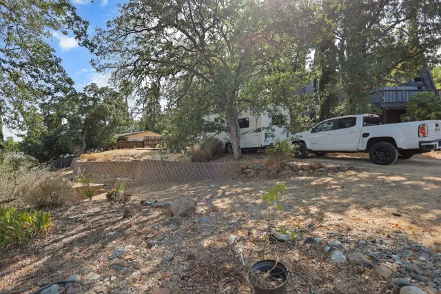 an aerial view of a house with a yard and garden