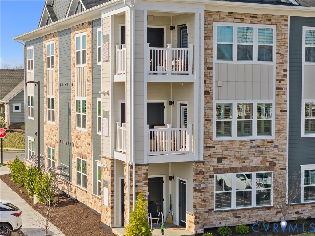 6725 Citory Way, Unit 202 Moseley, VA 23120 - Photo 7 of 42 a front view of a building with a glass windows