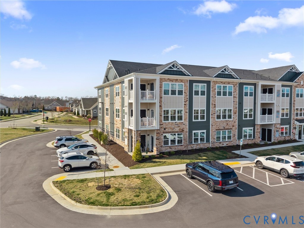 6725 Citory Way, Unit 202 Moseley, VA 23120 - Photo 8 of 42 a swimming pool with outdoor seating and yard