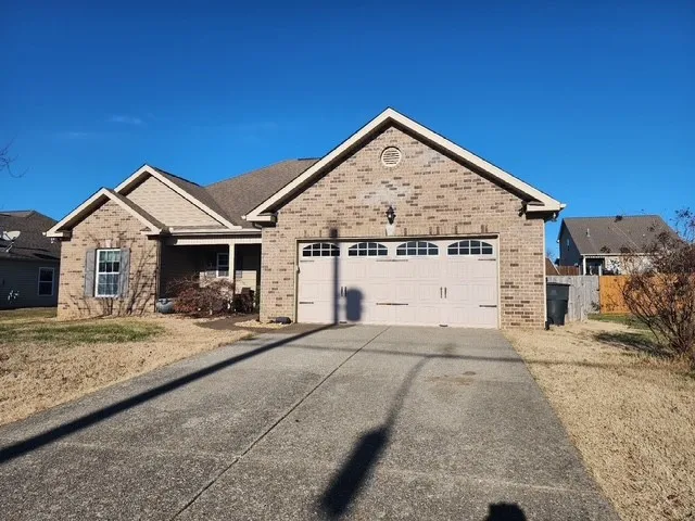 a view of a house with backyard