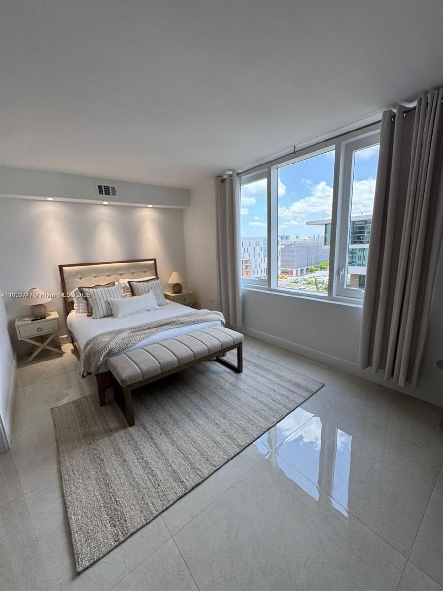 2301 Collins Avenue, Unit 731 Miami Beach, FL 33139 - Photo 11 of 31 a bedroom with a bed and window