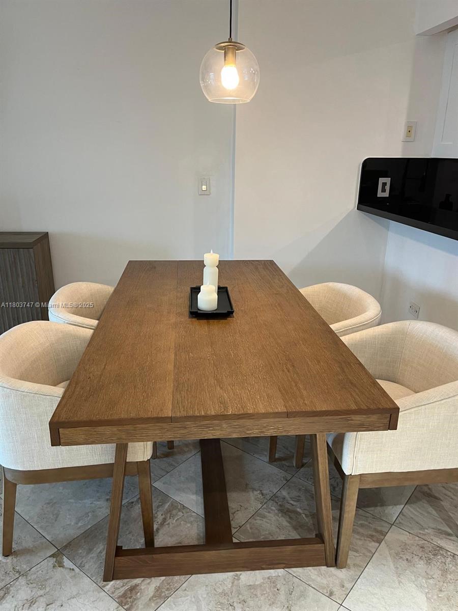 2301 Collins Avenue, Unit 731 Miami Beach, FL 33139 - Photo 30 of 31 a view of table and chair