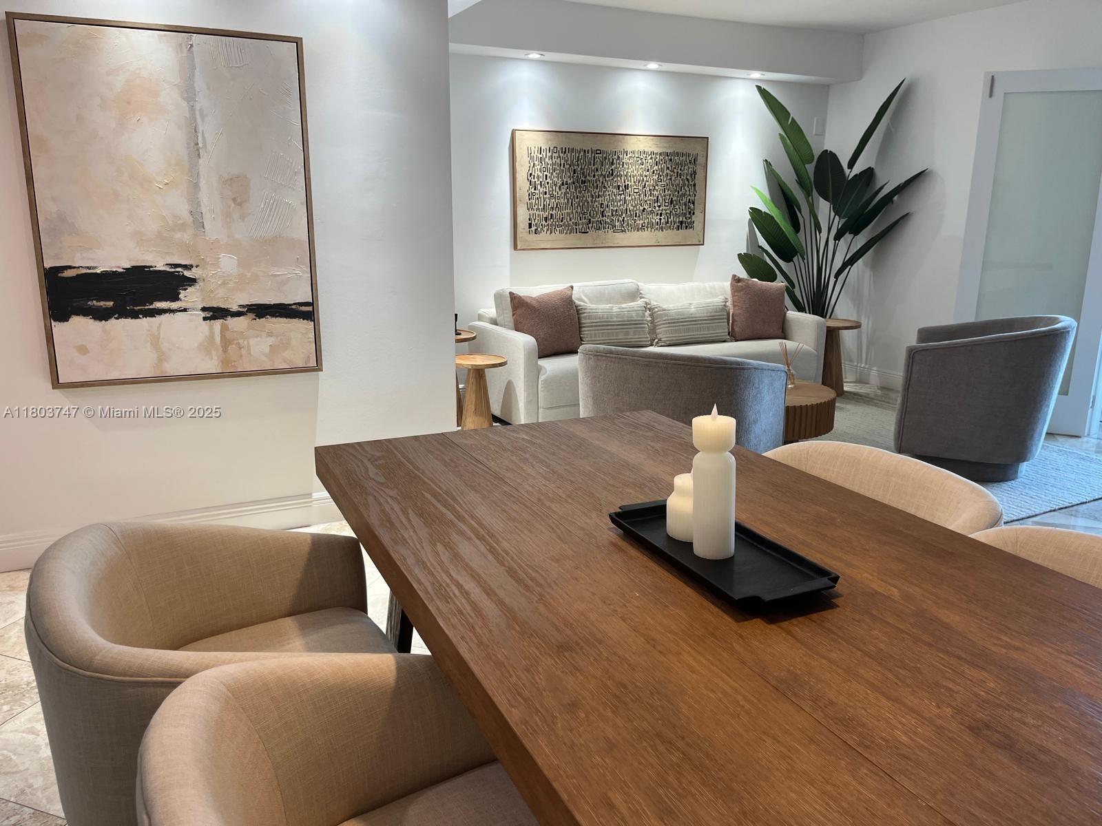 2301 Collins Avenue, Unit 731 Miami Beach, FL 33139 - Photo 3 of 31 a living room with furniture flowerpot and wooden floor