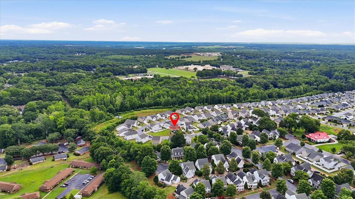 365 Sliding Rock Drive Pendleton, SC 29670 - Photo 40 of 46 An aerial perspective showcases a residential neighborhood nestled amidst a vast, verdant landscape.