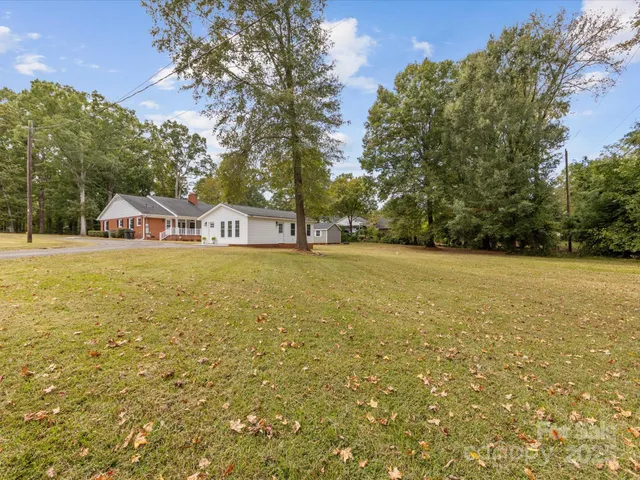 a view of a field with an trees