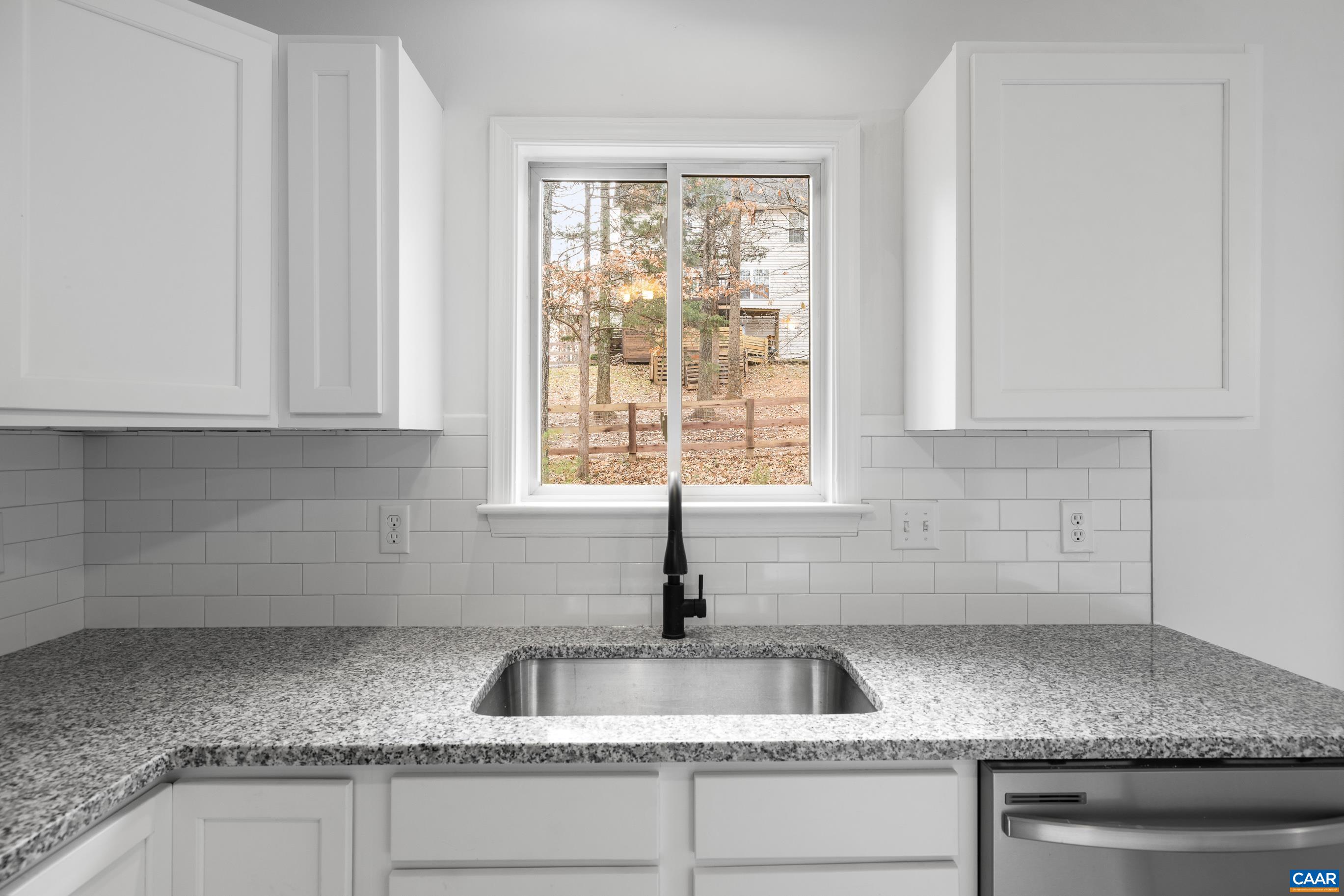 33 Brougham Road Palmyra, VA 22963 - Photo 14 of 49 a kitchen with granite countertop a sink and a window