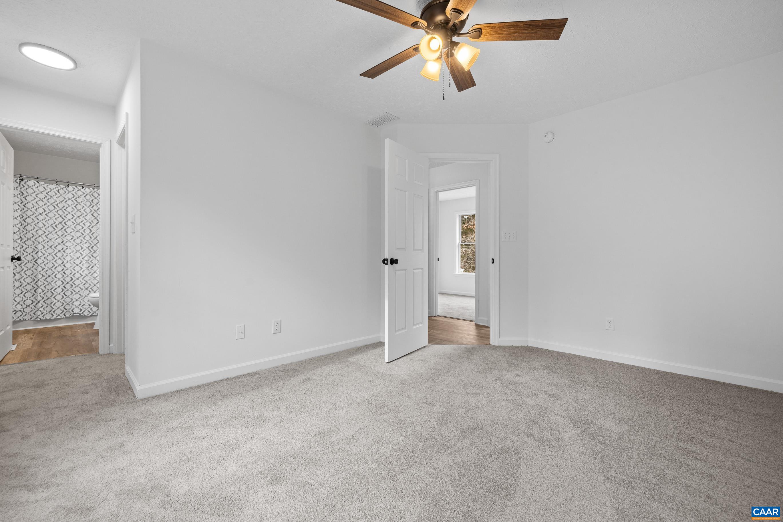 33 Brougham Road Palmyra, VA 22963 - Photo 17 of 49 an empty room with closet and a chandelier fan