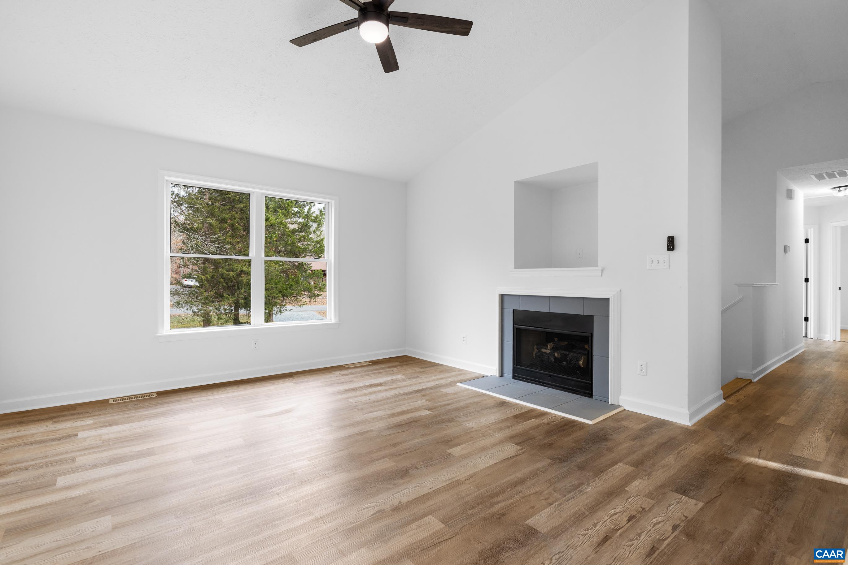 33 Brougham Road Palmyra, VA 22963 - Photo 4 of 49 wooden floor fireplace and windows in a room