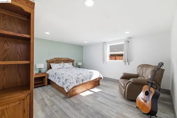 a bedroom with a bed and furniture