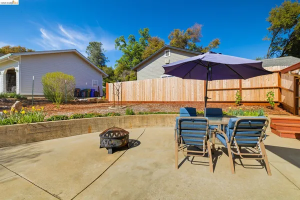 a view of a chairs and table in the patio
