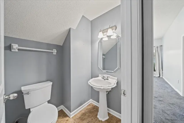 a large kitchen with cabinets and stainless steel appliances