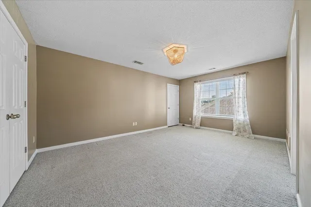 a swimming pool with outdoor seating and yard