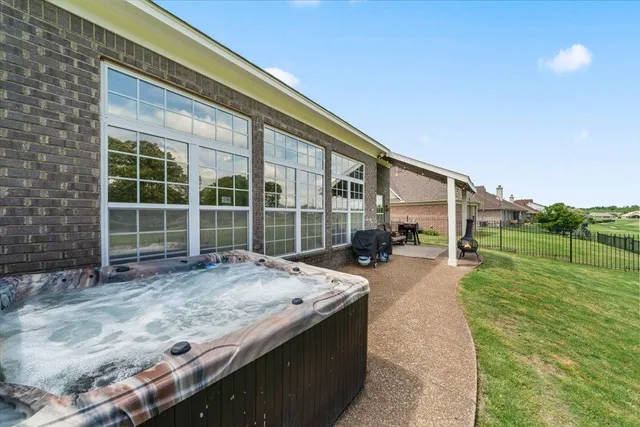 a view of a house with backyard and porch