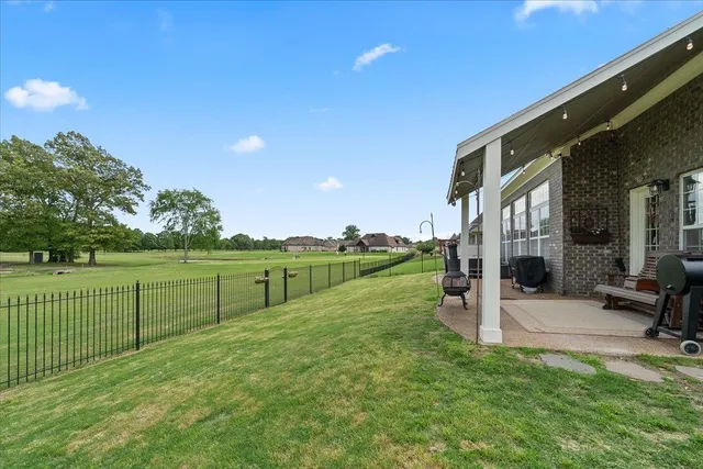 a front view of a house with a garden and porch