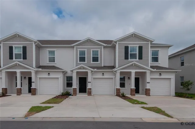 a front view of a house with yard