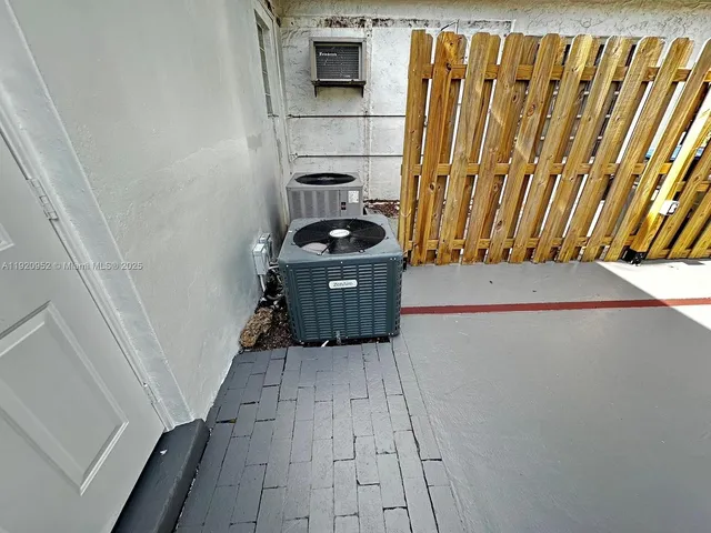 a view of a lake with houses in back