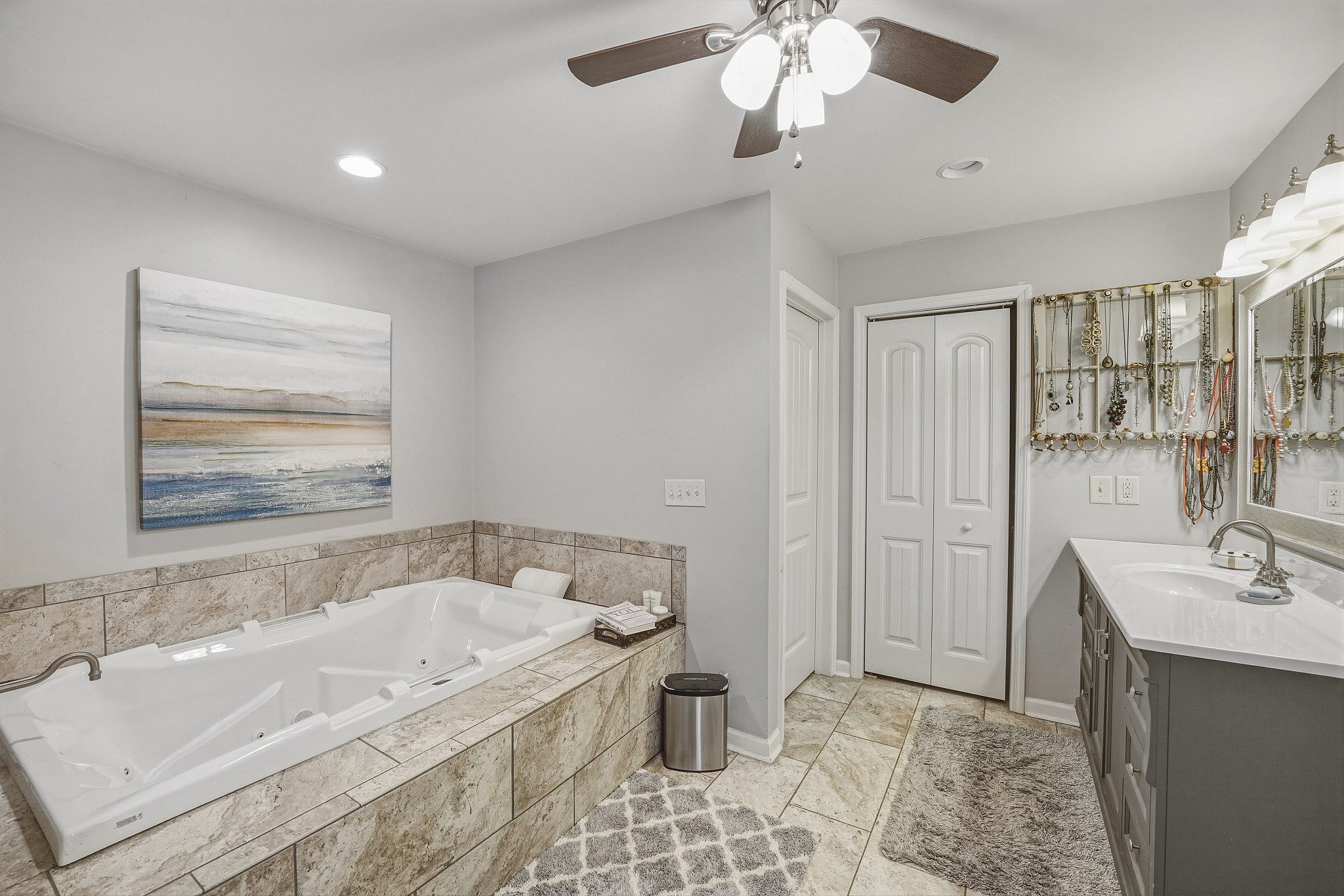 811 Hogans Branch Road Hendersonville, TN 37075 - Photo 15 of 34 a bathroom with a tub a sink and a mirror