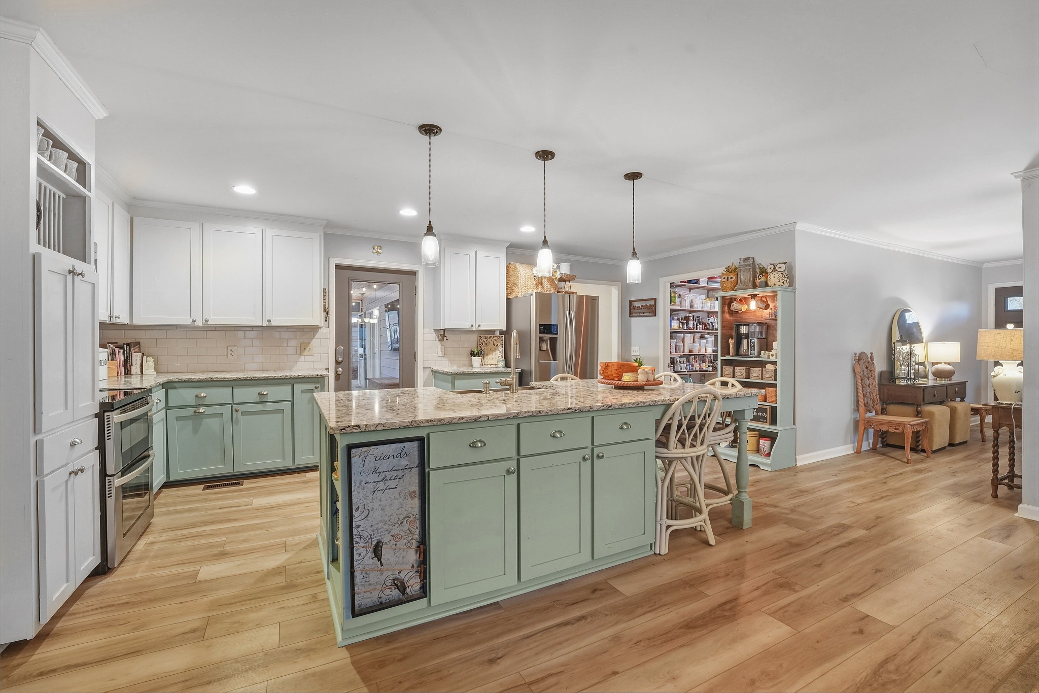 811 Hogans Branch Road Hendersonville, TN 37075 - Photo 2 of 34 a kitchen with stainless steel appliances granite countertop a sink cabinets and wooden floor