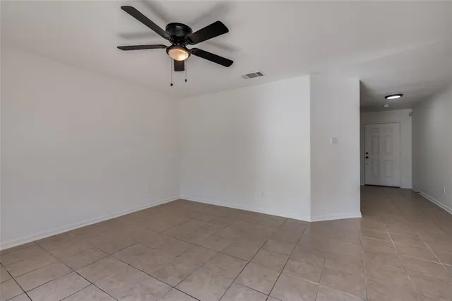 a view of a big room with carpet