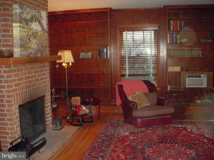 202 North Tyrone Road Baltimore, MD 21212 - Photo 4 of 24 Warm family room with brick woodburning FP