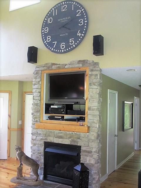 3248 Riley Creek Road Normandy, TN 37360 - Photo 6 of 24 a living room with a fireplace and a flat screen tv