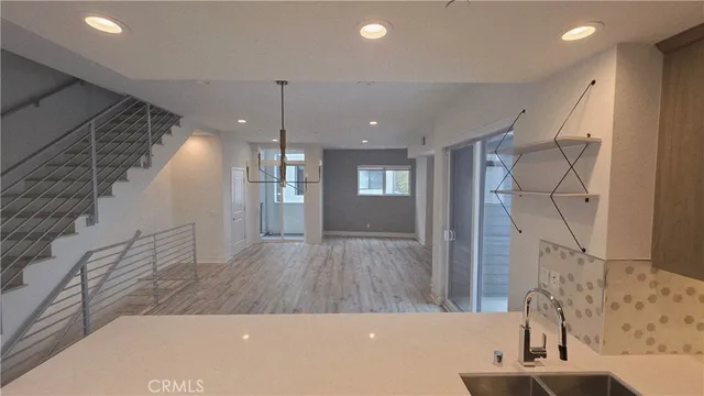 a view of a living room and with a ceiling fan