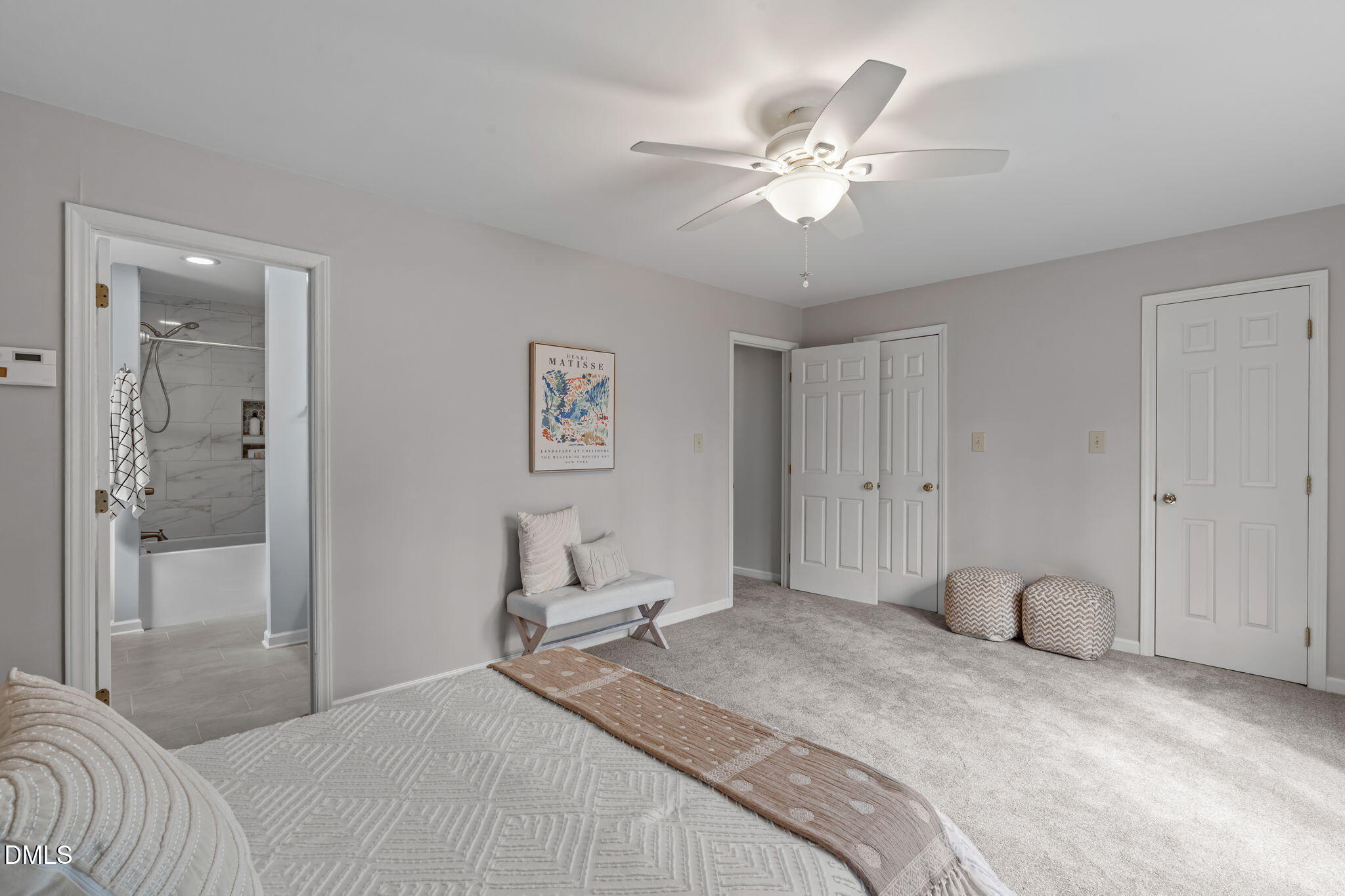 3304 Wade Avenue Raleigh, NC 27607 - Photo 19 of 38 a bedroom with a bed and a chandelier