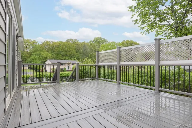 a view of a balcony with wooden floor
