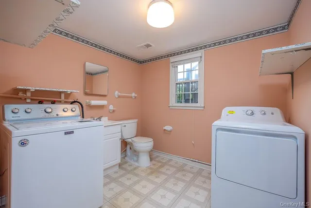 a utility room with dryer and washer