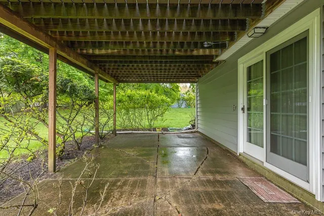 a view of porch with green space