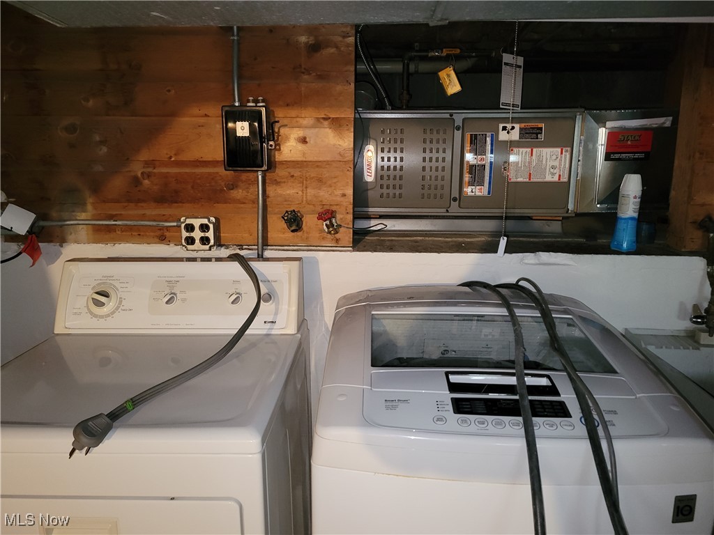 29119 Edgewood Road Bay Village, OH 44140 - Photo 36 of 40 Laundry room featuring washing machine and clothes dryer