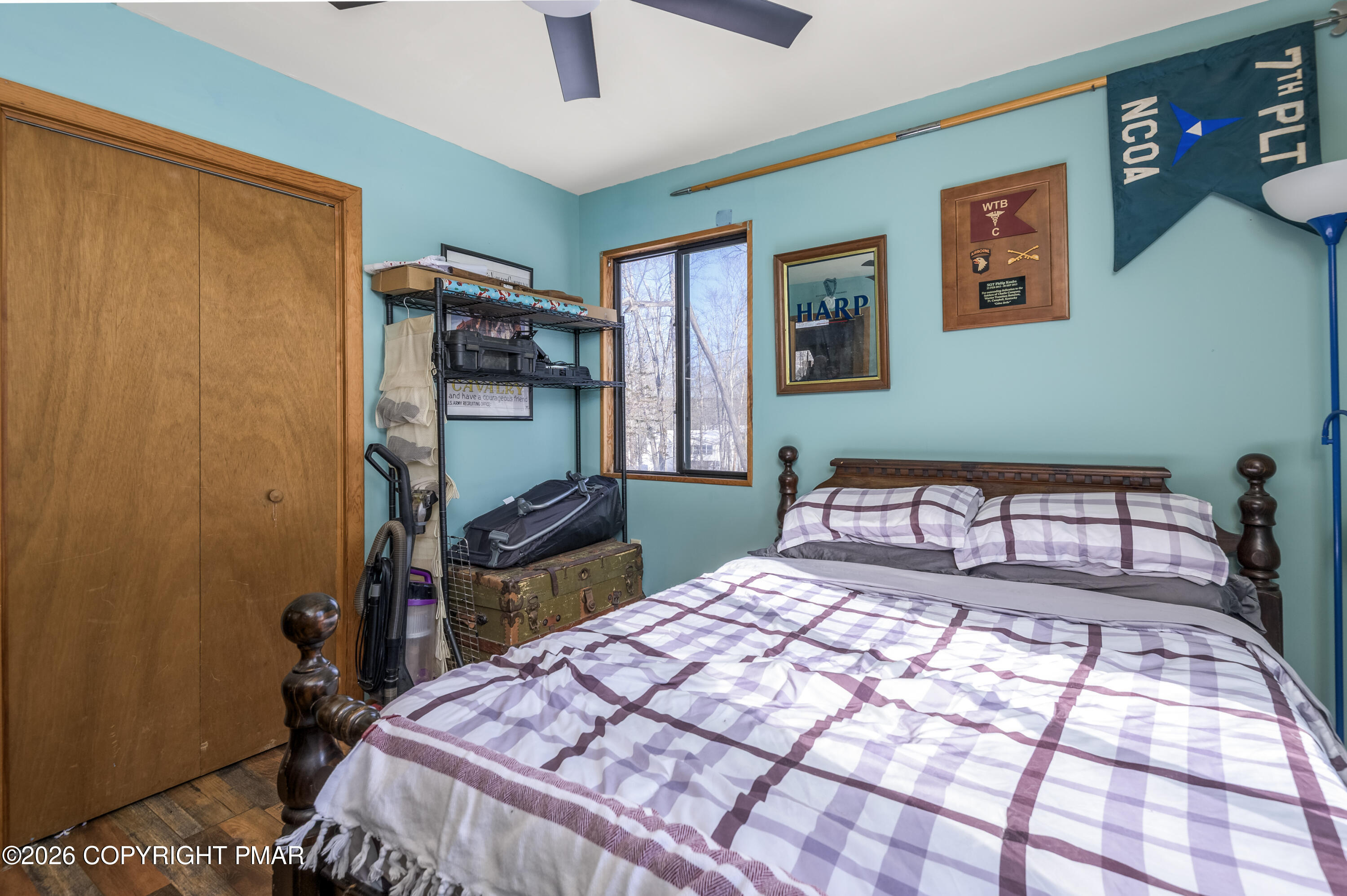 218 Blue Jay Court Bushkill, PA 18324 - Photo 12 of 19 a bedroom with a bed and wooden floor