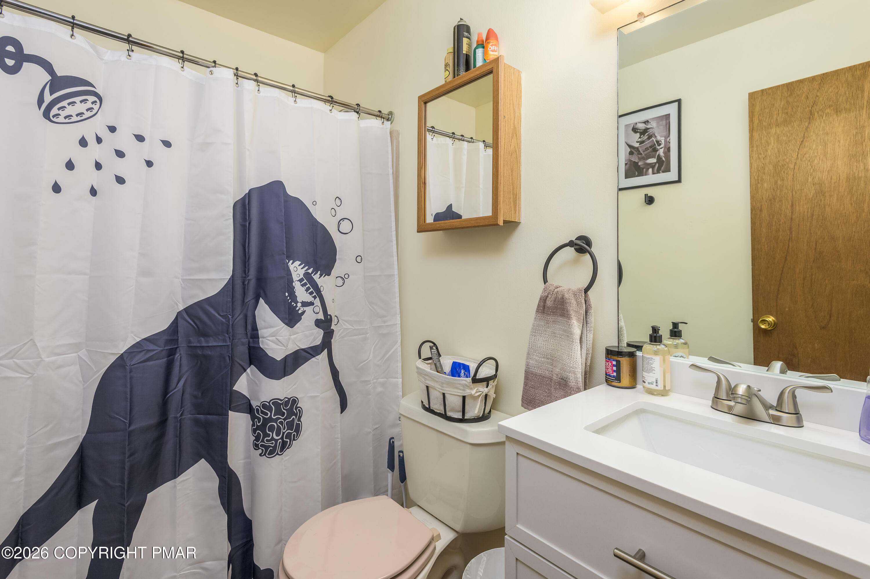 218 Blue Jay Court Bushkill, PA 18324 - Photo 13 of 19 a bathroom with a sink a toilet and a mirror