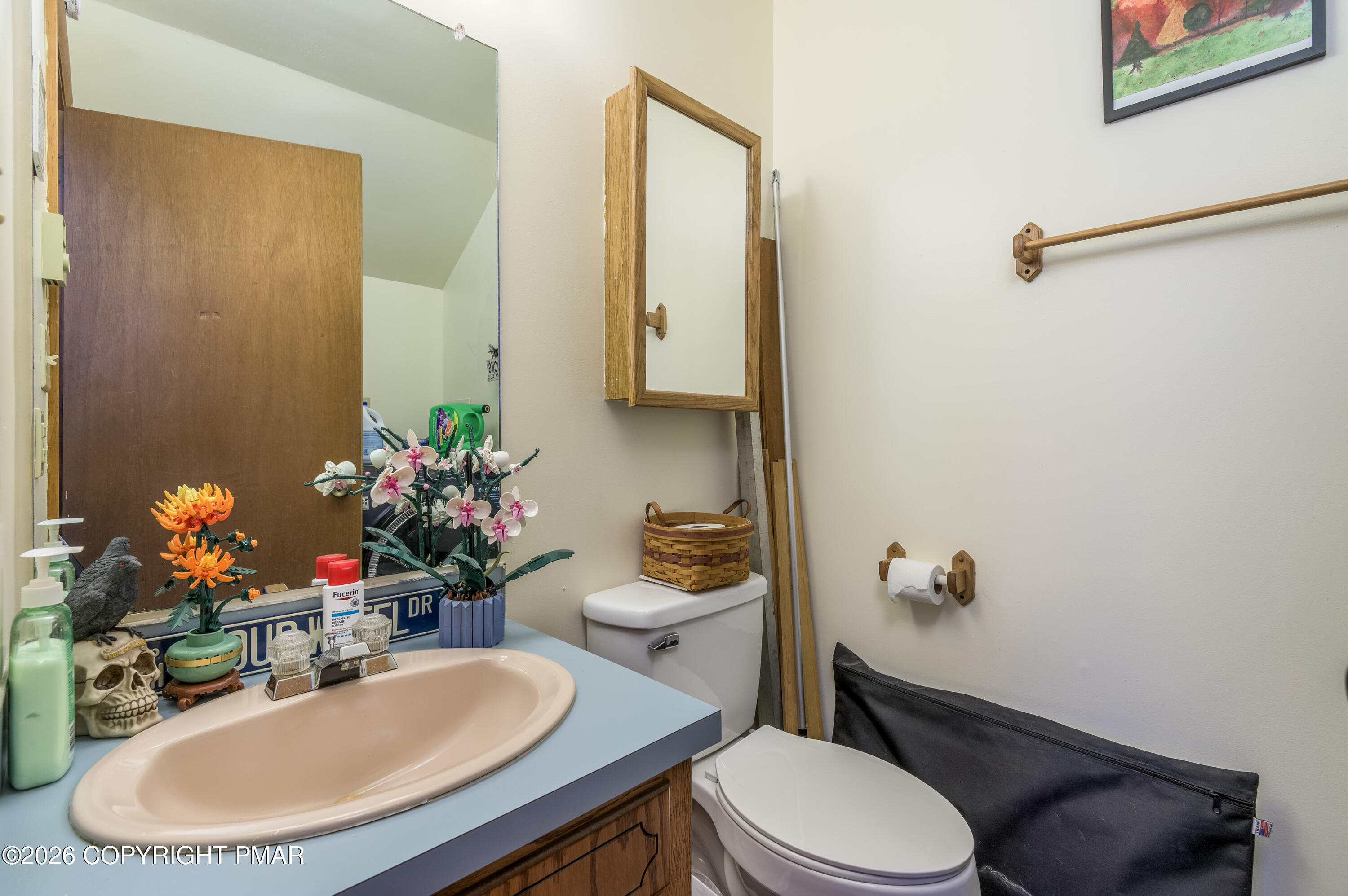 218 Blue Jay Court Bushkill, PA 18324 - Photo 16 of 19 a bathroom with a sink mirror vanity and toilet