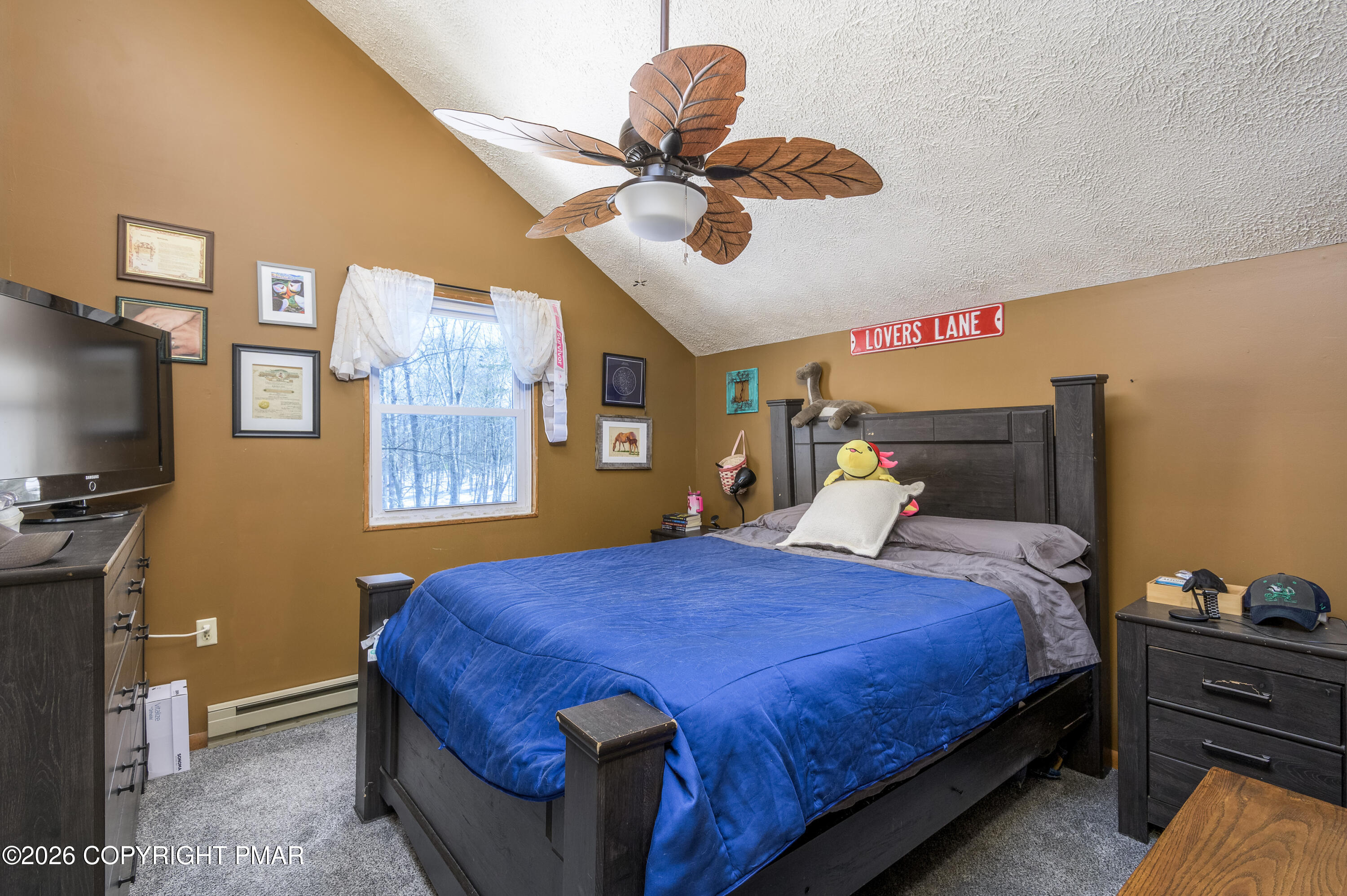 218 Blue Jay Court Bushkill, PA 18324 - Photo 19 of 19 a bedroom with a bed and a chandelier