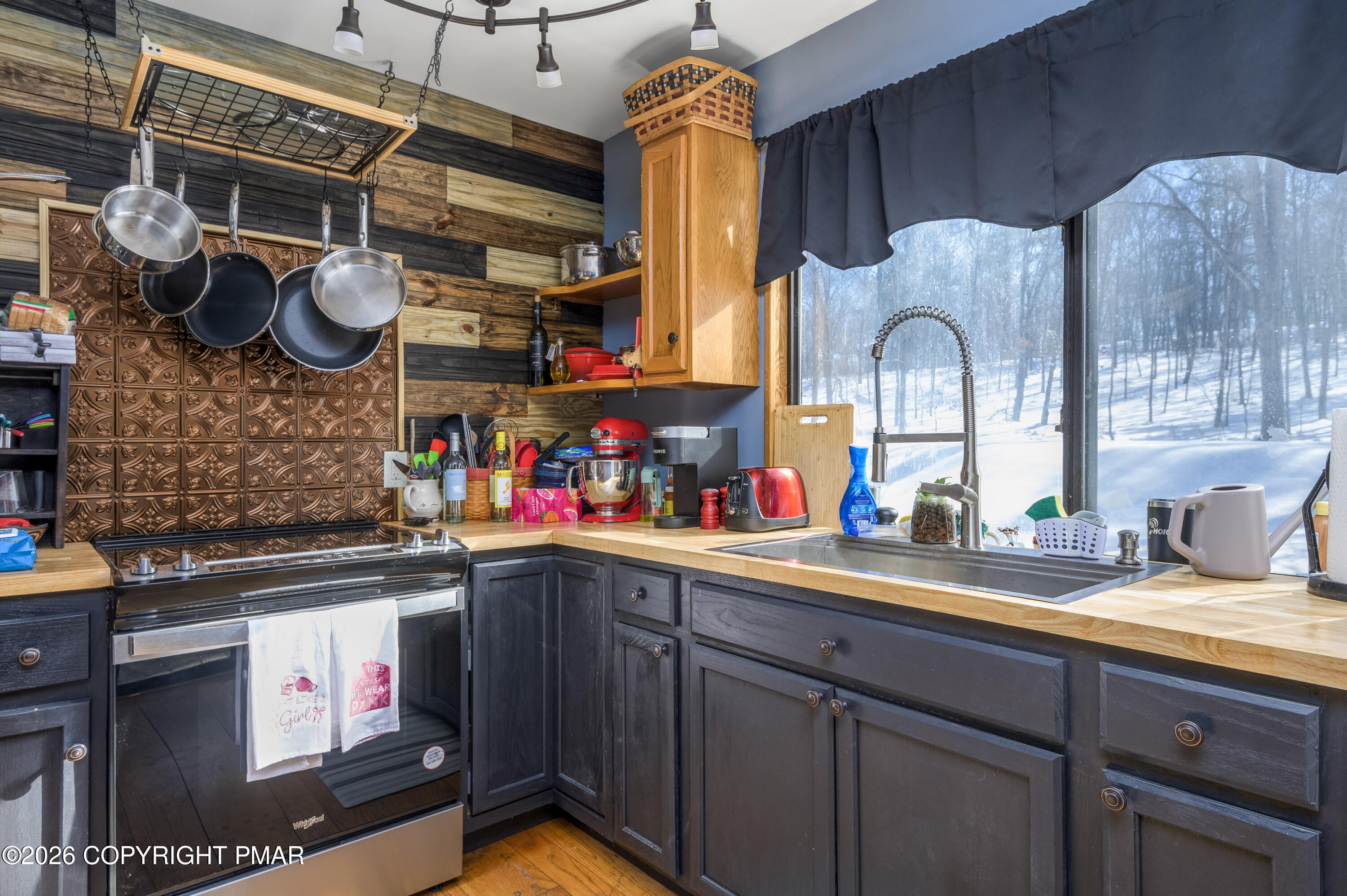 218 Blue Jay Court Bushkill, PA 18324 - Photo 9 of 19 a kitchen with stainless steel appliances granite countertop a sink and a stove
