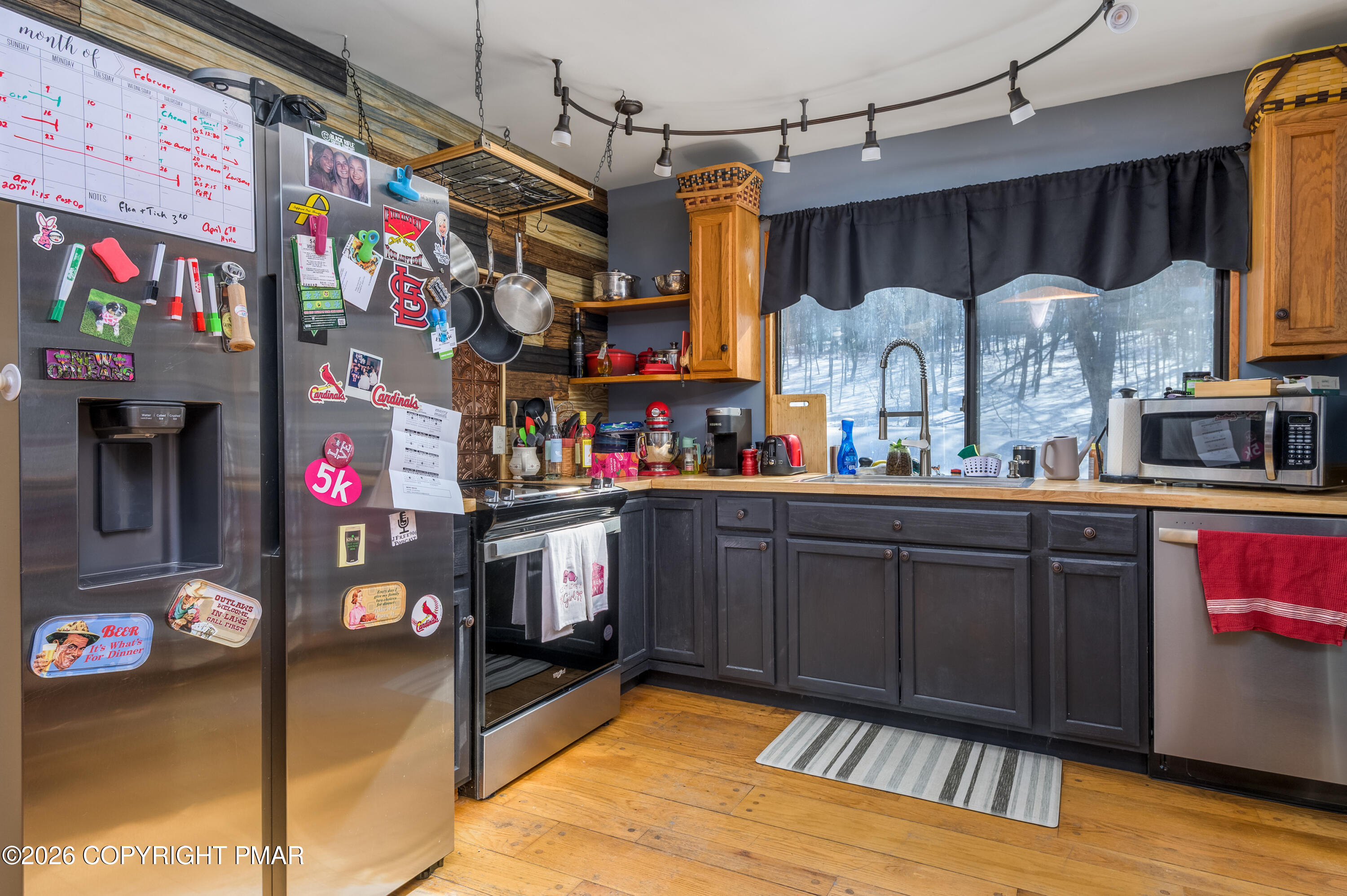 218 Blue Jay Court Bushkill, PA 18324 - Photo 10 of 19 a kitchen that has a lot of cabinets and a wooden floor
