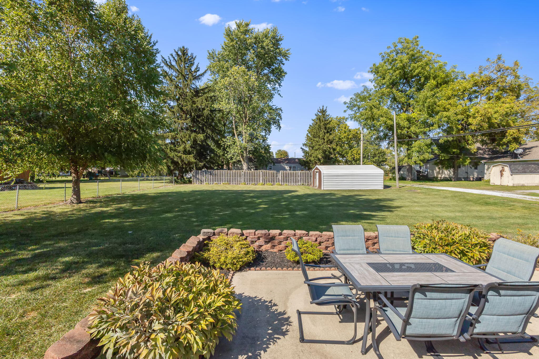 810 East Grace Street Rensselaer, IN 47978 - Photo 14 of 17 a view of a lake with a table and chairs