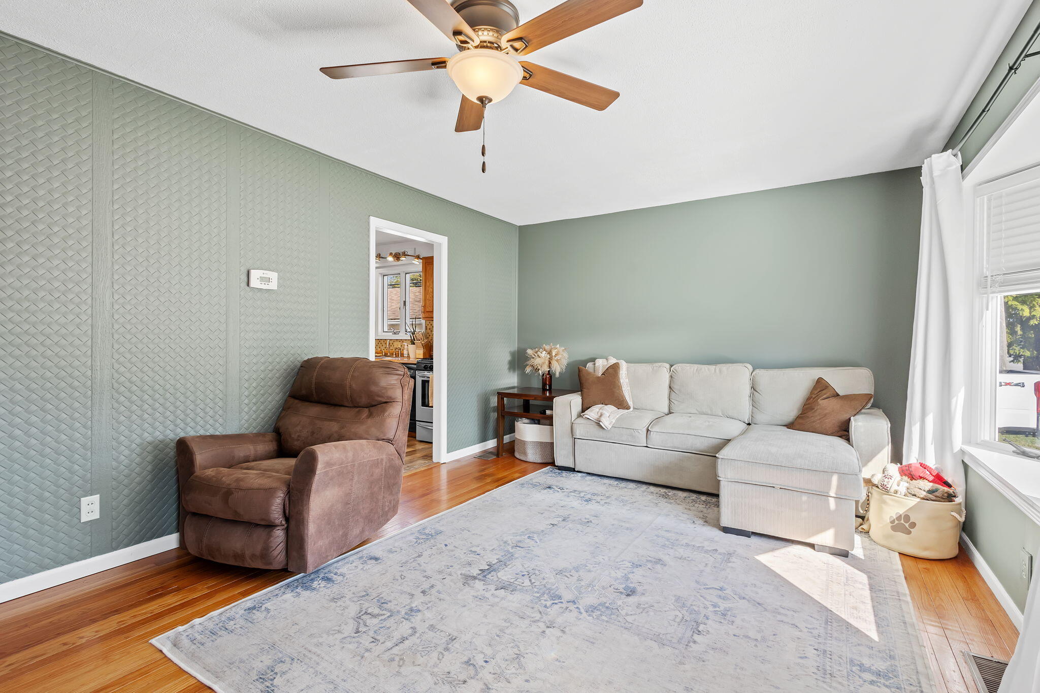810 East Grace Street Rensselaer, IN 47978 - Photo 3 of 17 a living room with furniture and a ceiling fan